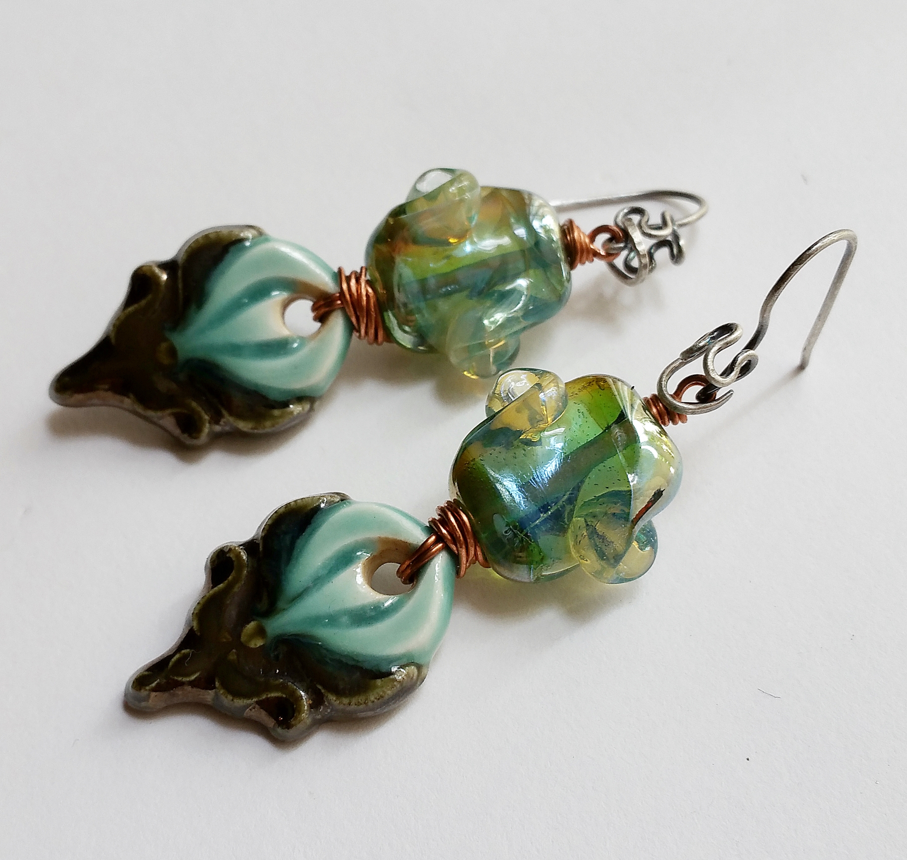 Ceramics and Lampworks, copper and sterling silver.
