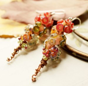 Beautiful Boro lampworks, mixed with Copper, a few pieces of Peridot, finished with Sterling Silver earwire.